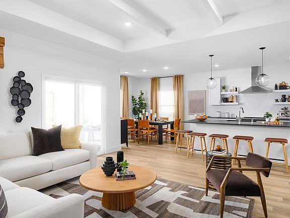 Great room with coffered ceiling and white painted ceiling beams