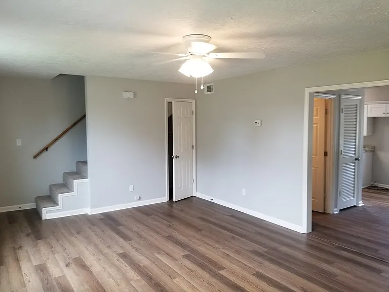Living room. Dining room and kitchen to the right.