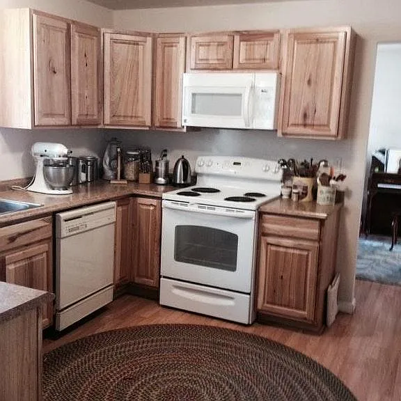 View of kitchen showing stove/ove and microwave