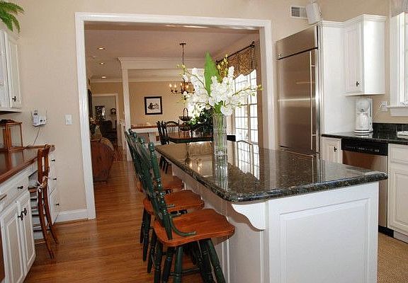 Kitchen View to Daily Dining Area and Family Room