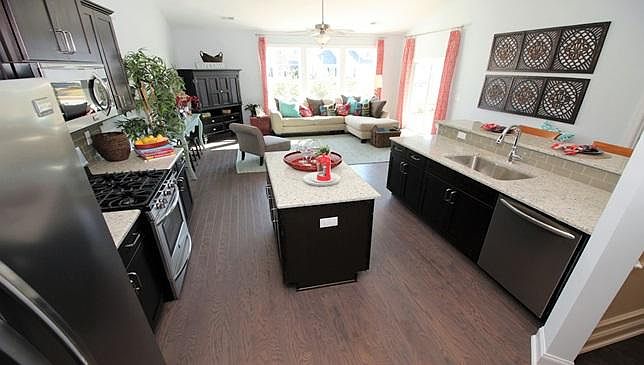This is a model photo the home will be available June 1. Amazing Island Kitchen with High end appliances! Envision you entertaining in this open floor plan!