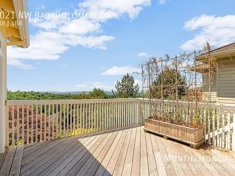 9021 NW Bartholomew Dr — Photo 34