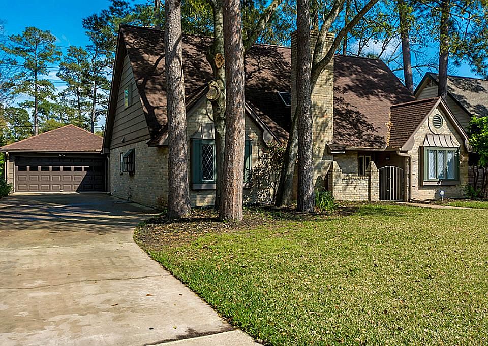Long driveway leading to the oversize 4 car garage that meas