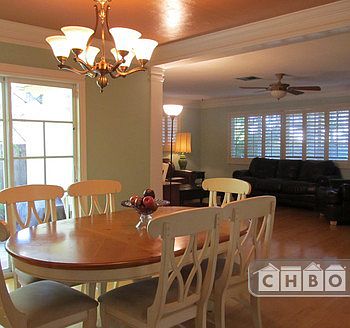 Dining Room with Double Doors leading to Gas Grill in Yard