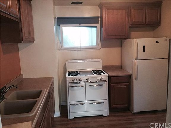 Newer cabinets, countertop, classic 50's gas stove, your ref