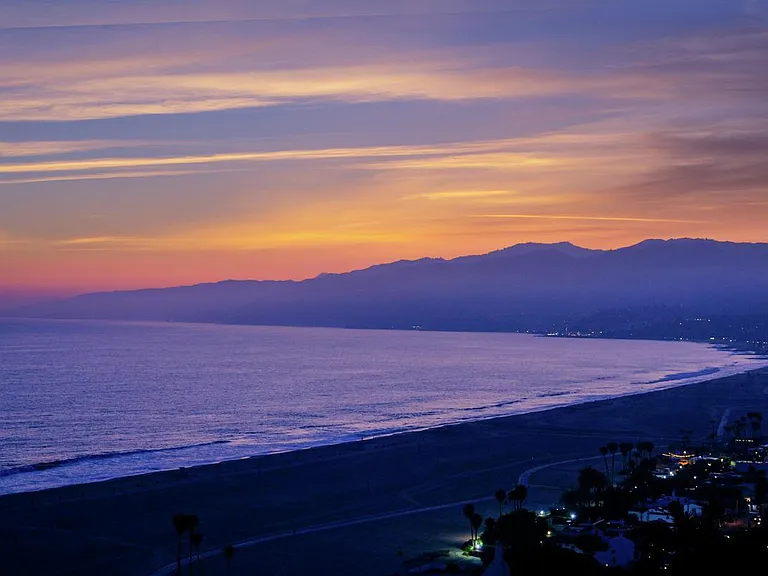 Watch the sun set over the Pacific from your balcony