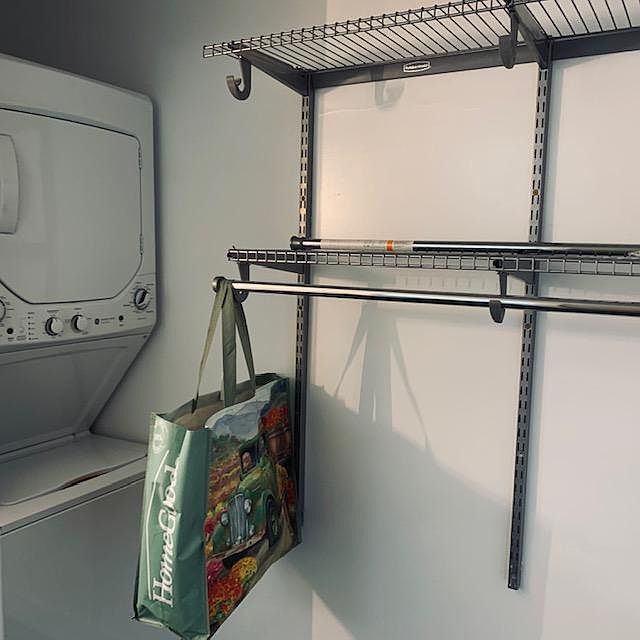 Closet with built ins and Washer/Dryer in residence