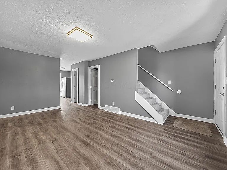 Living room with luxury vinyl plank flooring.