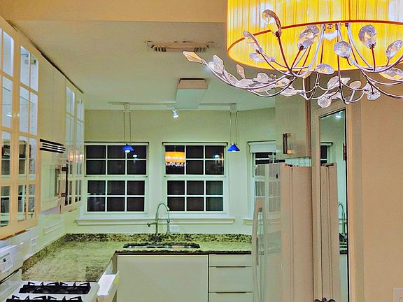 kitchen has 4 windows for commanding view of front yard