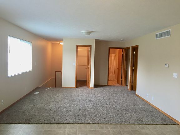 family room with closet and full bathroom