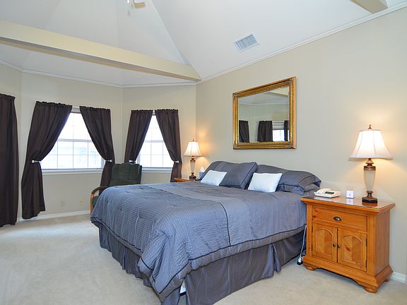Beams in Bedroom with Windows Galore