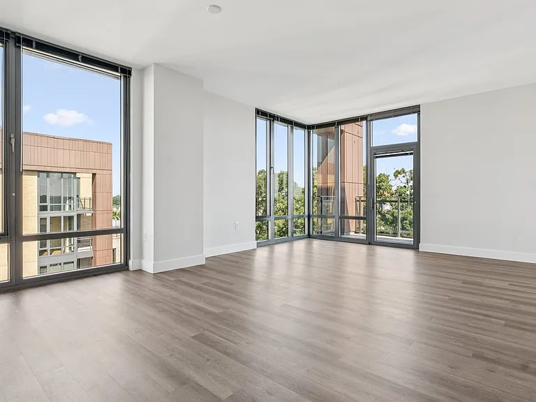 Enjoy floor to ceiling windows and a spacious living room with ample natural light