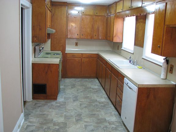 Kitchen with lots of cabinets, stove, dishwasher