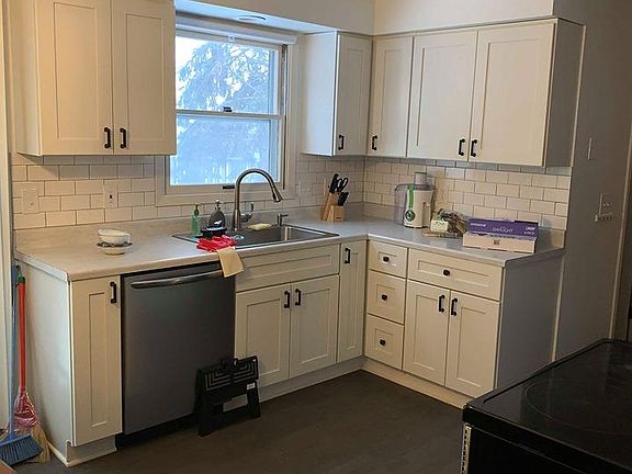 Kitchen; beautiful white cabinets and stainless steel appliances.
