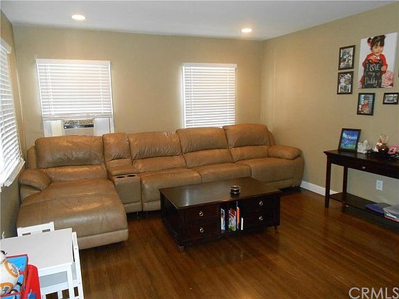 living room with recessed lighting and hardwood floors