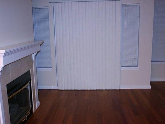 Fire place with a sliding door leading to a small private patio