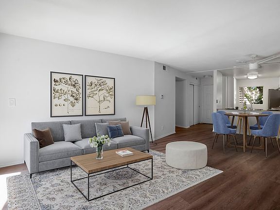 Renovated Package I living and dining room with hard surface flooring