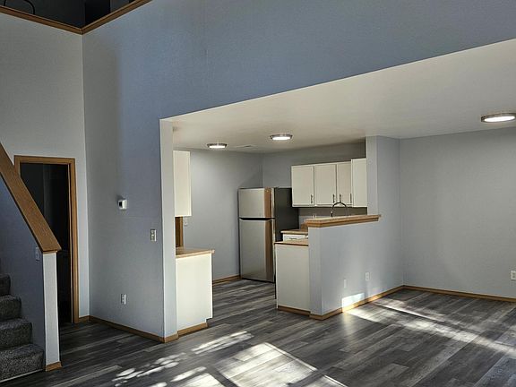 Living/Dining/Kitchen w/half bath near stairs