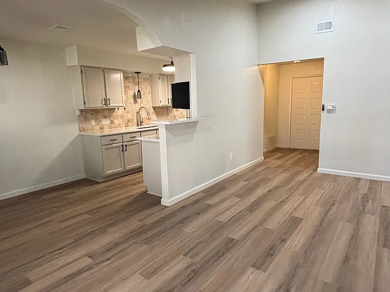 Living room & kitchen from back french doors