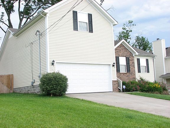 SIX FOOT PRIVACY FENCE IN BACK YARD, THICK GRASS!