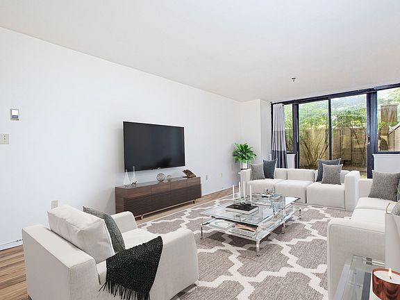 Living Room with entrance to patio (Virtually Staged)