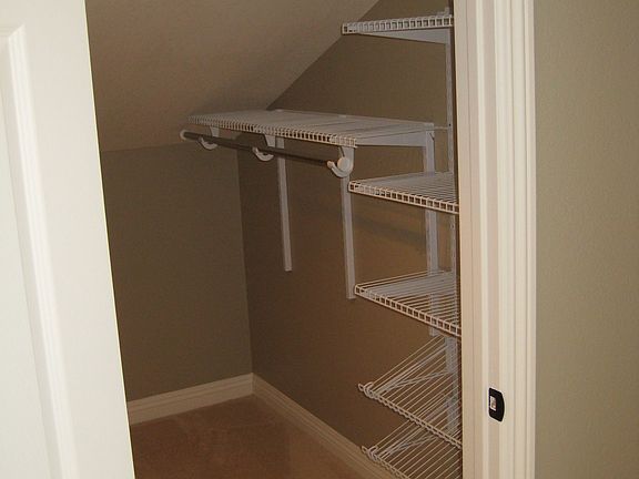 Closet organizers in upstairs bedroom