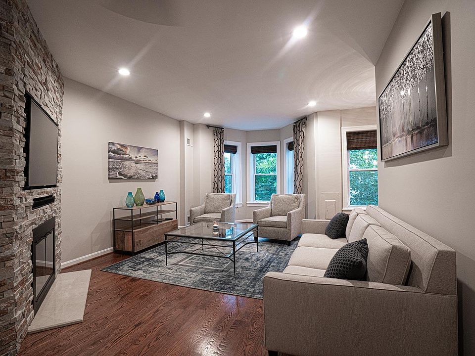 This residence is tastefully decorated featuring a functional wood burning fireplace, exposed brick, hardwood floors throughout, renovated kitchen, dishwasher, air conditioning and a main level washer and dryer.