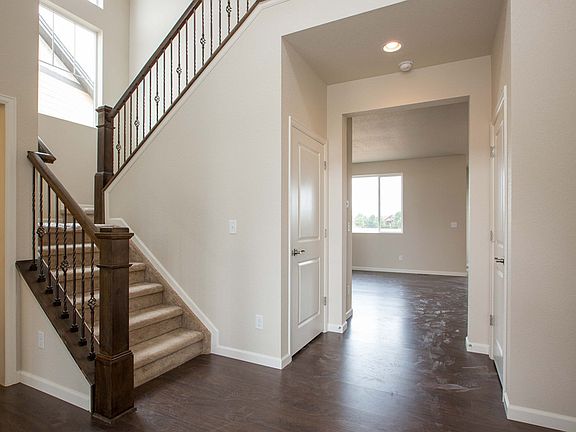 Entry with beautiful wrought iron railing