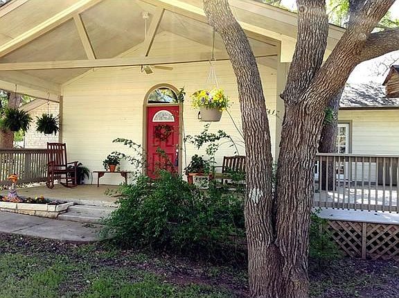 Plenty of room for entertaining and enjoying the outdoors with covered front porch and wrap around d
