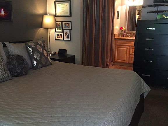 Master bedroom and vanity. Enclosed yard and sliding door entrance through master bedroom.