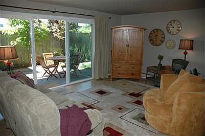 The living room is spacious and seats many guests.