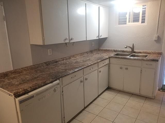 Kitchen with dishwasher and lots of cabinets and counter space