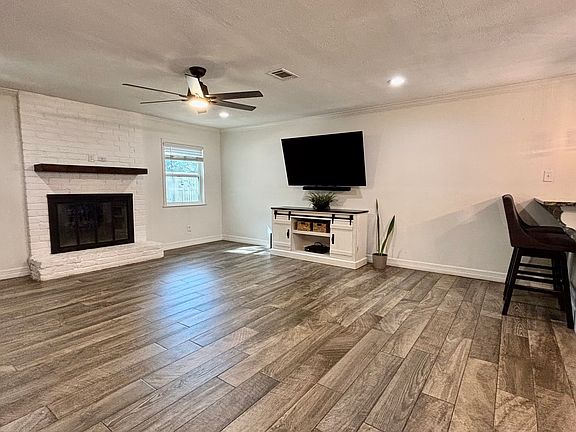 Living Room: "Open living area with central heating and cooling."