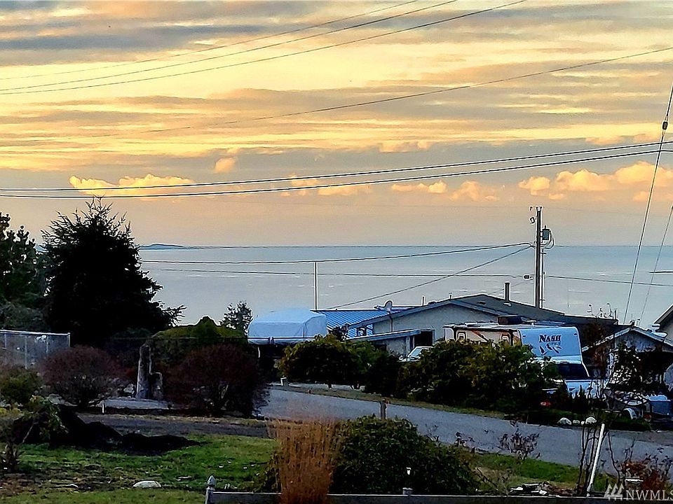 View at 5pm, out the living room window...the Straits with a tip of Diamond point.