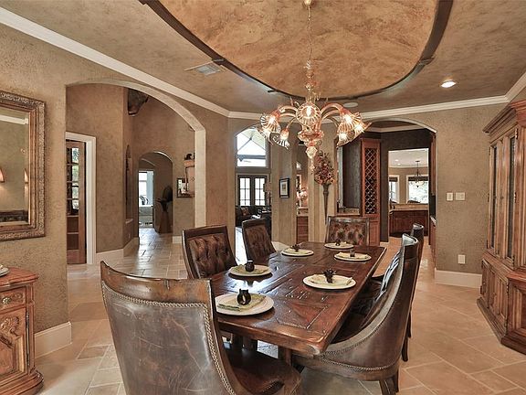 Formal Dining with exquisite ceiling detail and a wet bar