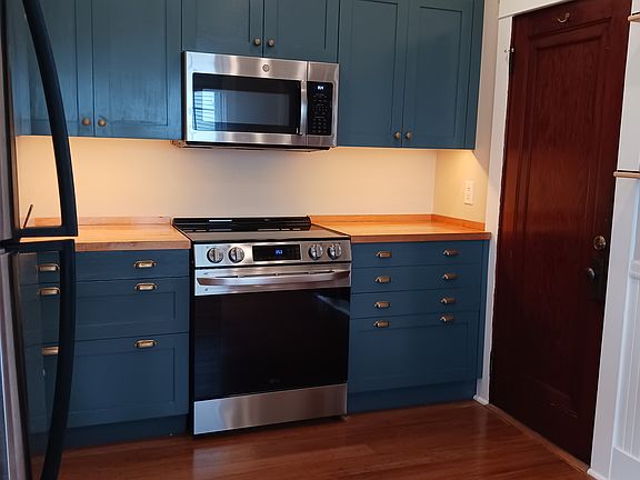 Kitchen with custom cabinets and lighting