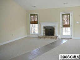 Family room has gas-log fp and surround sound.