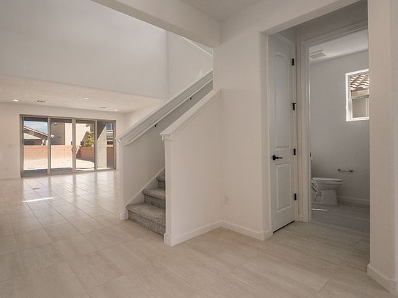 As you enter, you ll be greeted by a den and an open view into your home