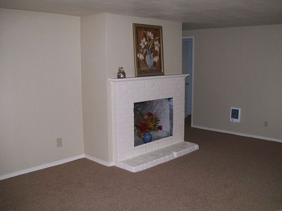 wood fireplace in living room