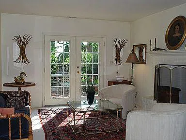 Lower Den opens to the yard. This level also has 3rd bedroom, 2nd bath and laundry.
