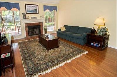 Open family room with vaulted ceilings and gas fireplace.  Perfe