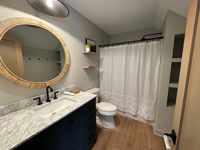 Full bathroom with tub/shower combo in upper level. This bathroom is shared by two bedrooms.