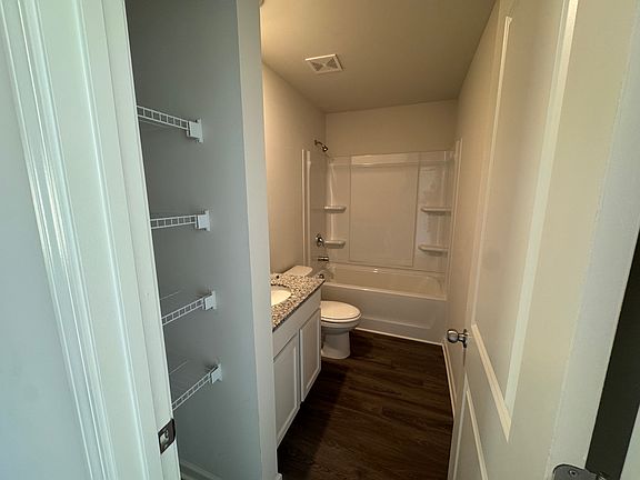 Upstairs bathroom with linen space