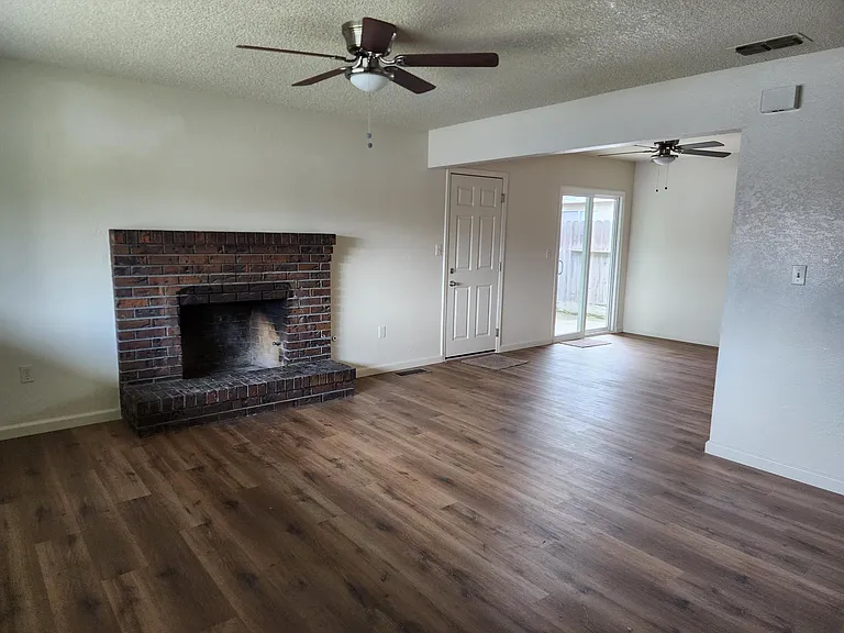 Living room with ceiling fan.