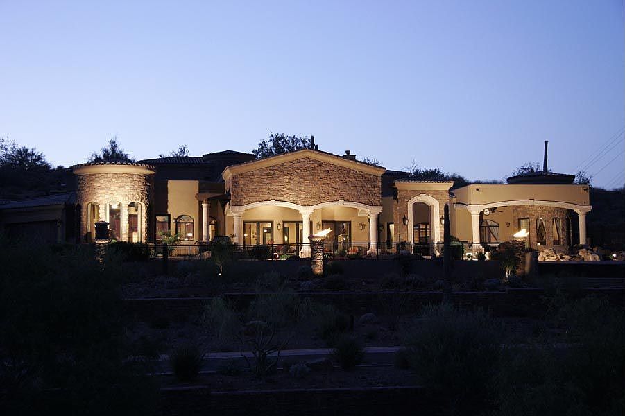 4 Cantera Firebowls lighting up the exterior of the house