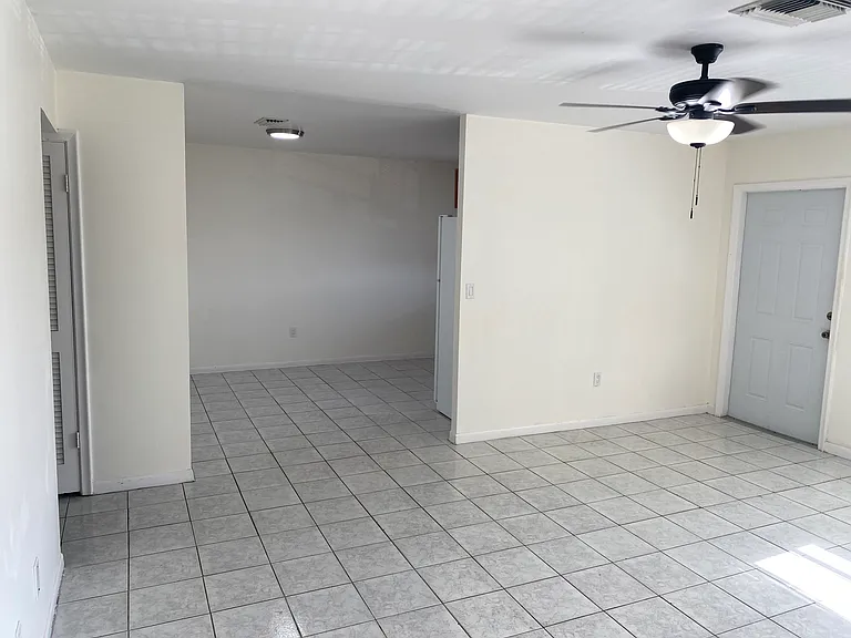 Living room opens to dining room and kitchen