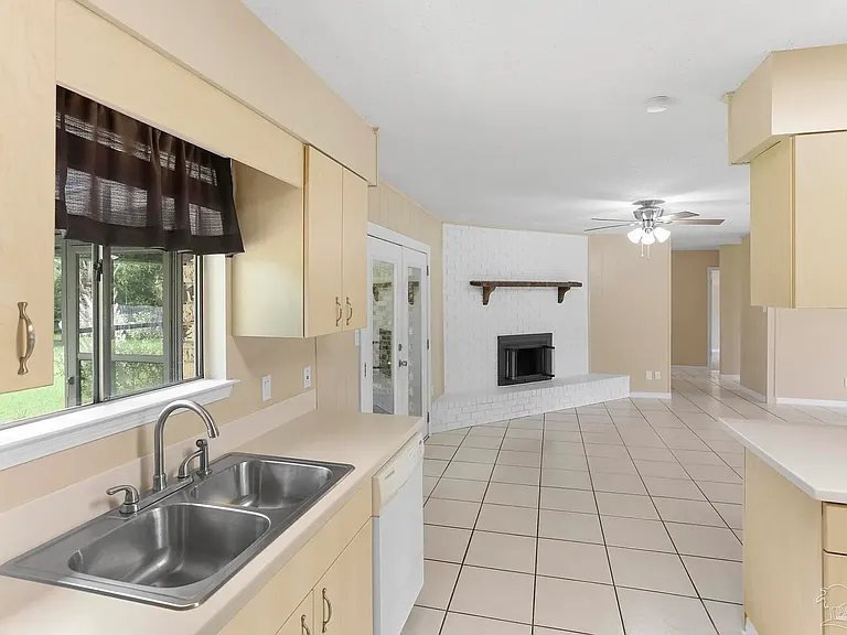 Kitchen sink looking out to Living room