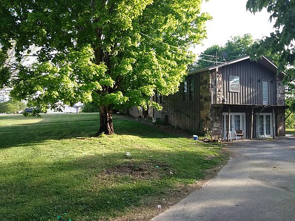 driveway to side of house and front yard.