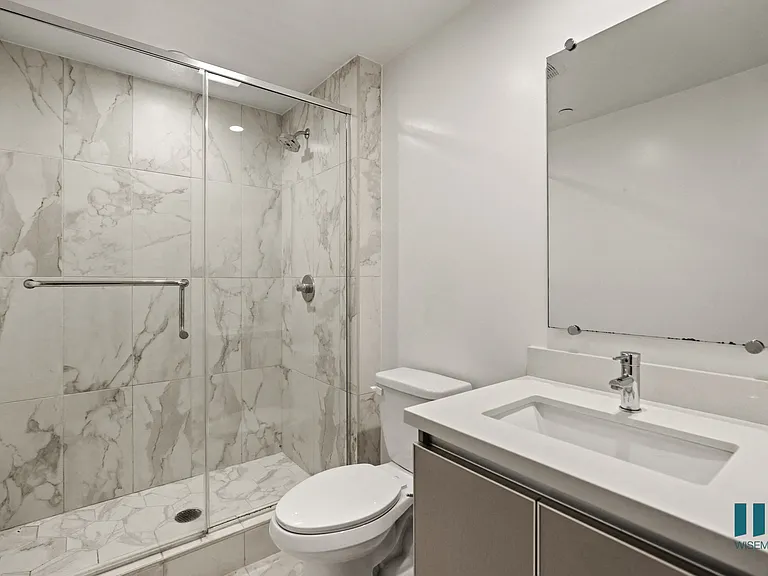 Bathroom with Walk-In Shower and Vanity Cabinet Storage
