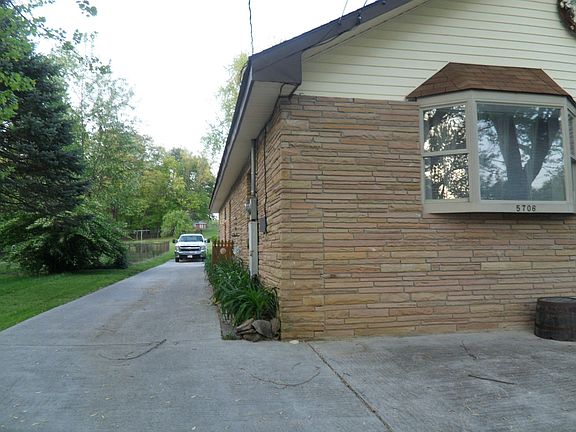 Left side drive into back with garage.